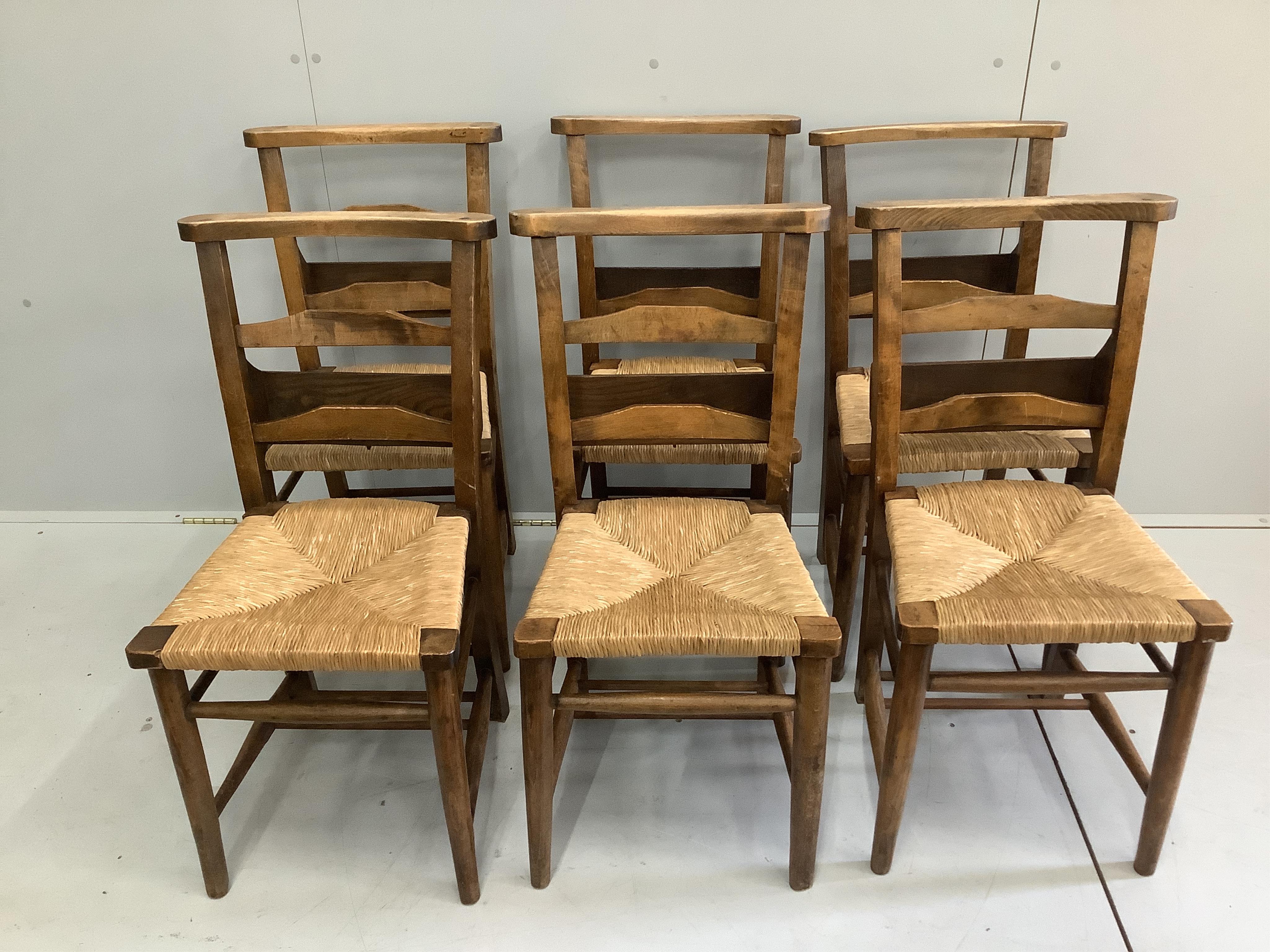 A set of six Victorian beech rush seat chapel chairs from Leicester Cathedral, width 42cm, height 81cm. Condition - fair